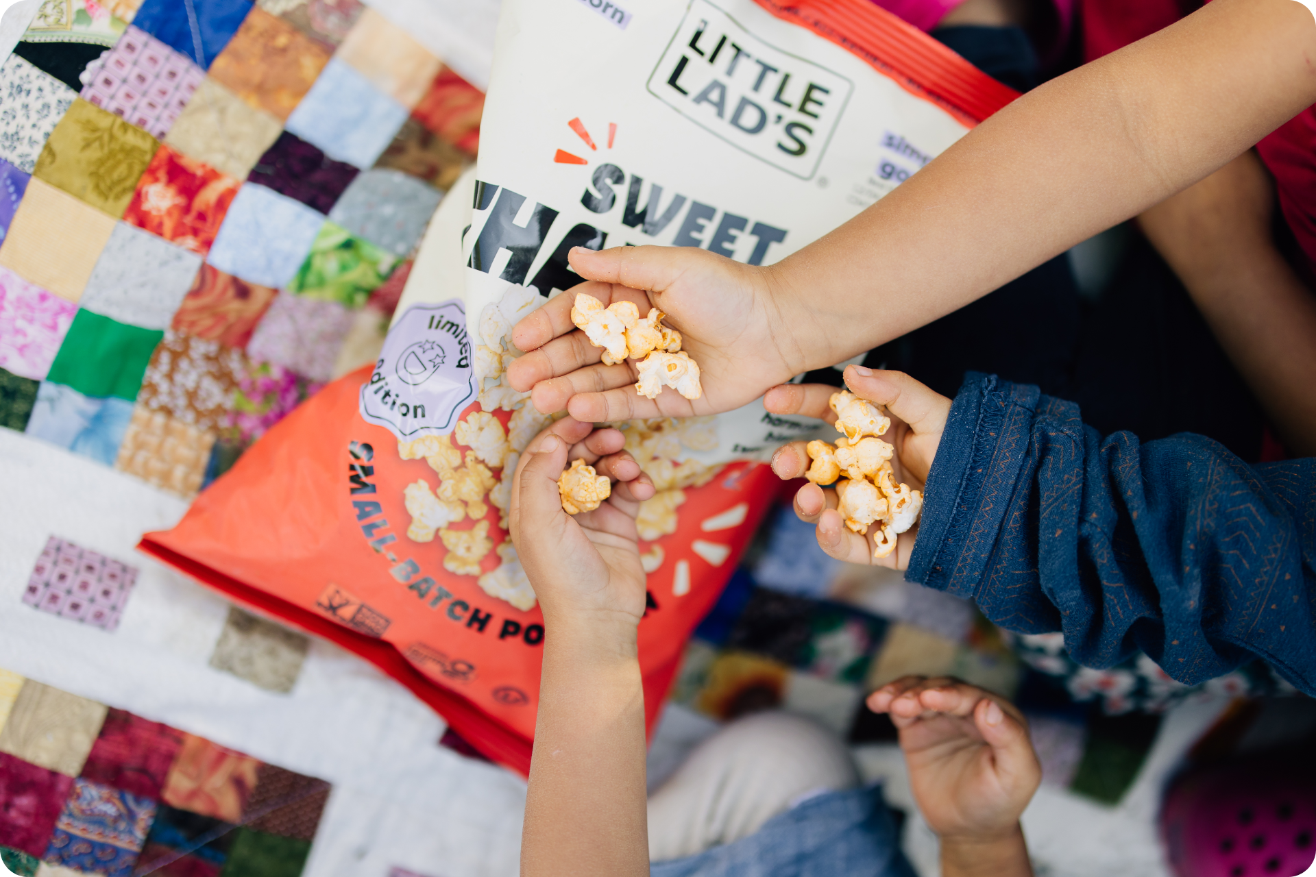 Little Lad's small-batch popcorn snack board with savory herbs, classic buttah, and Vermont maple buttah flavors surrounded by fresh fruit, nuts, and cheese
