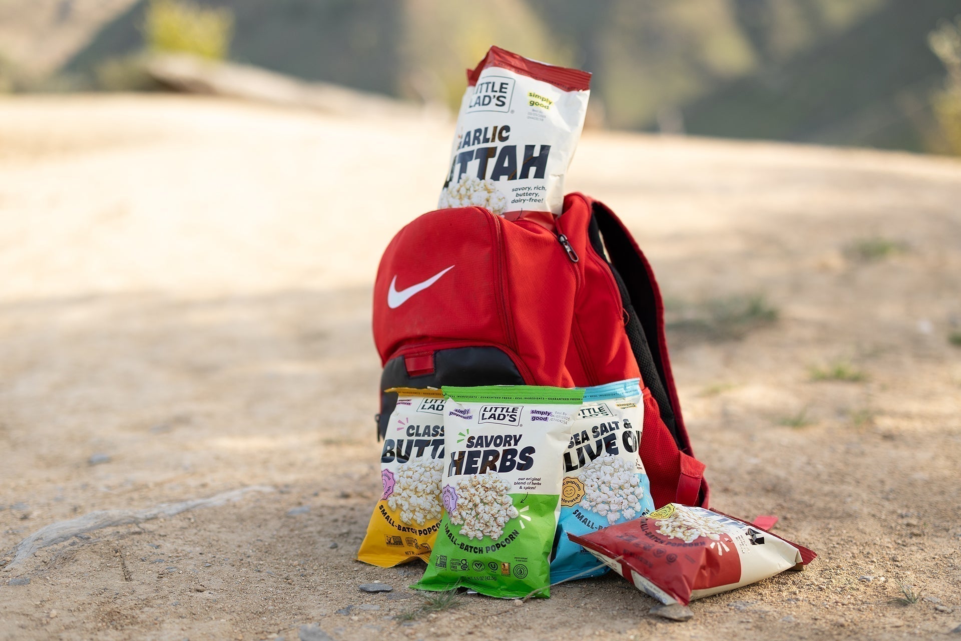Assorted Little Lad’s popcorn flavors in a bowl showcasing Sweet Thai Chili, Korean Chili Lime, and Classic Buttah